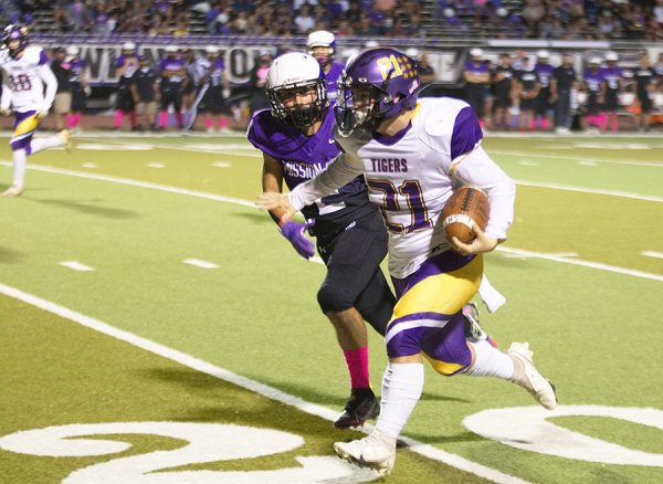 Lemoore's Andrew Moench scores on a 40-yard touchdown run for the Tigers' second touchdown of the game against Mission Oak Friday night in Tulare.